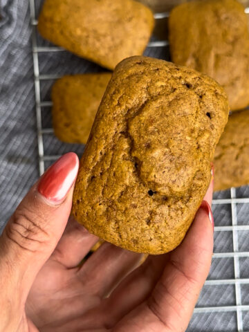Mini pumpkin breakfast loaf made with oat flour, cottage cheese, and protein powder, a cozy, high-protein pre-workout snack for fall.