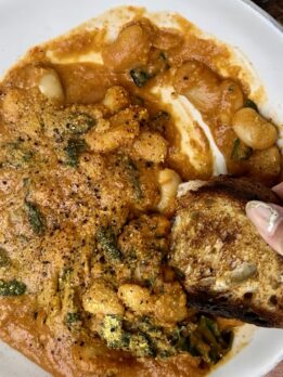 Cozy high protein pumpkin tomato soup with butter beans