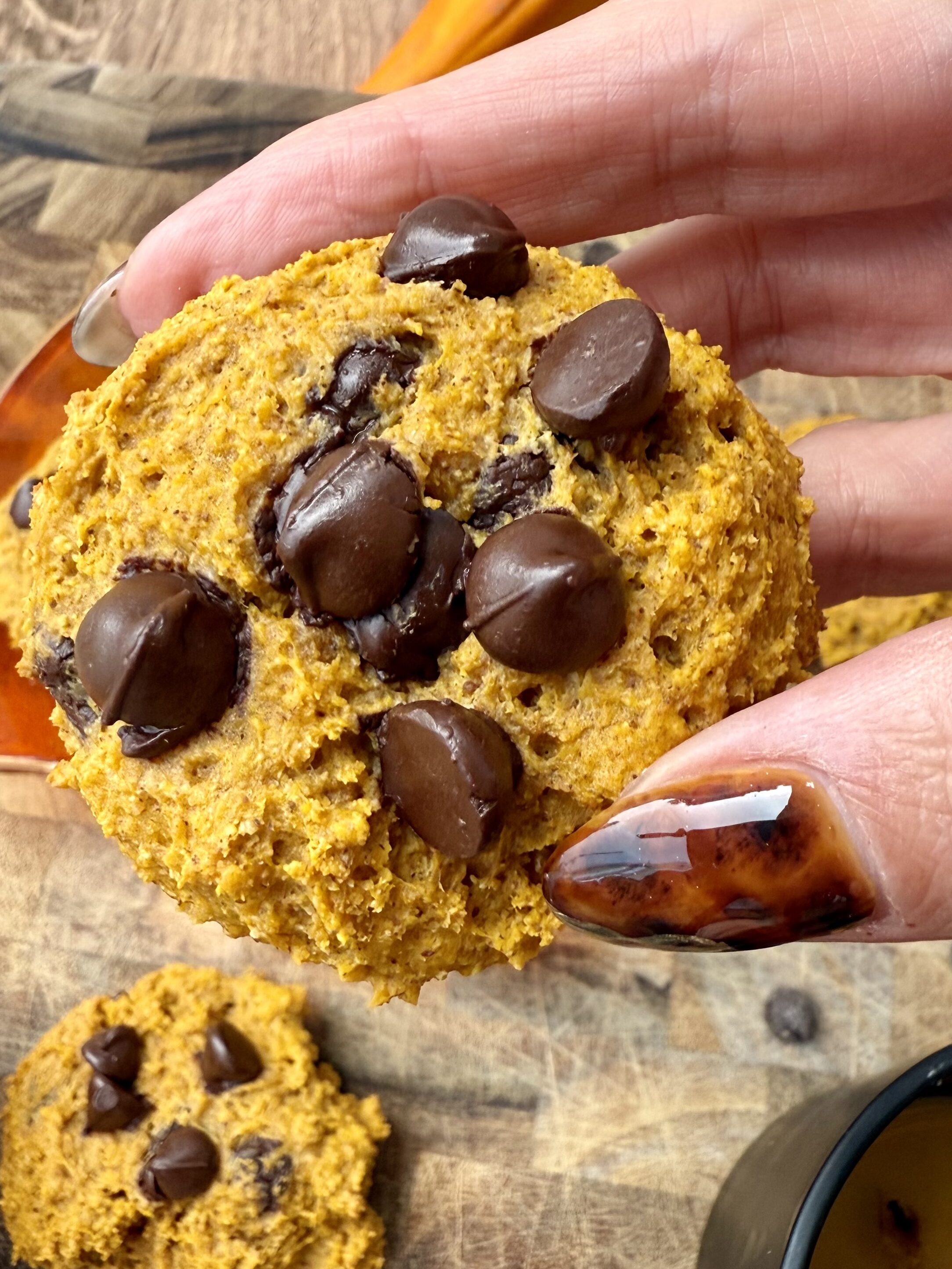 Batch of high-protein pumpkin cottage cheese cookies with chocolate chips.