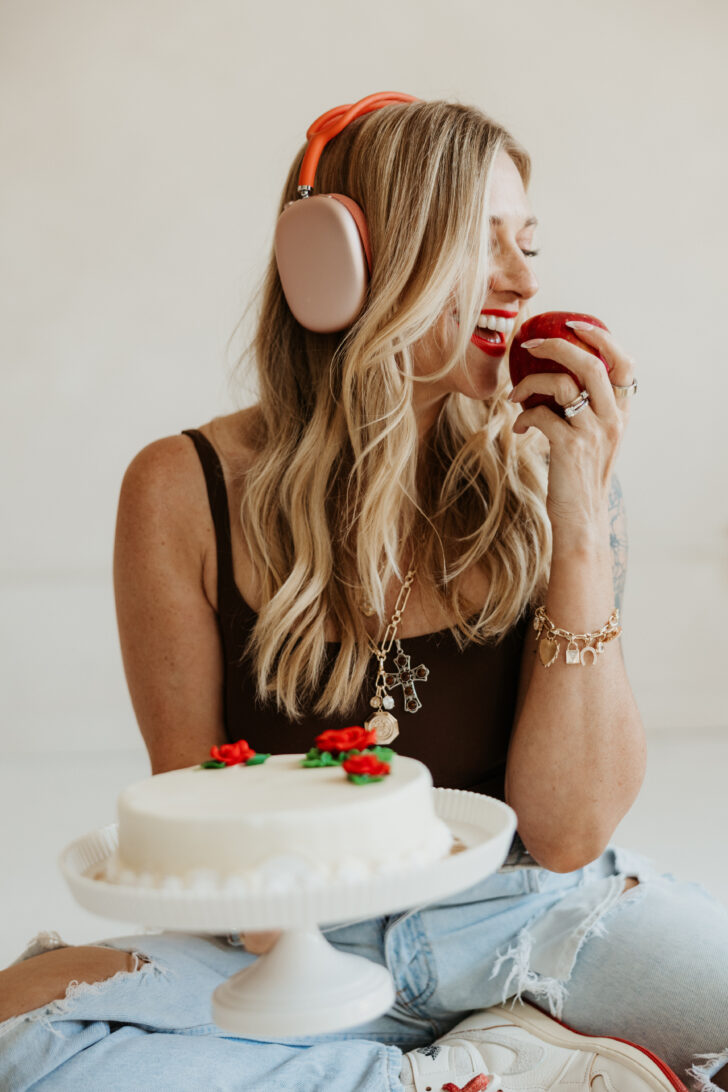 dietitian eating an apple and holding a cake