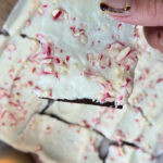 Frozen Greek yogurt peppermint bark with protein powder and candy cane pieces.