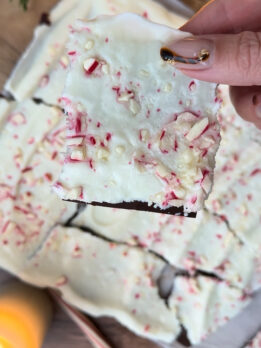 Frozen Greek yogurt peppermint bark with protein powder and candy cane pieces.