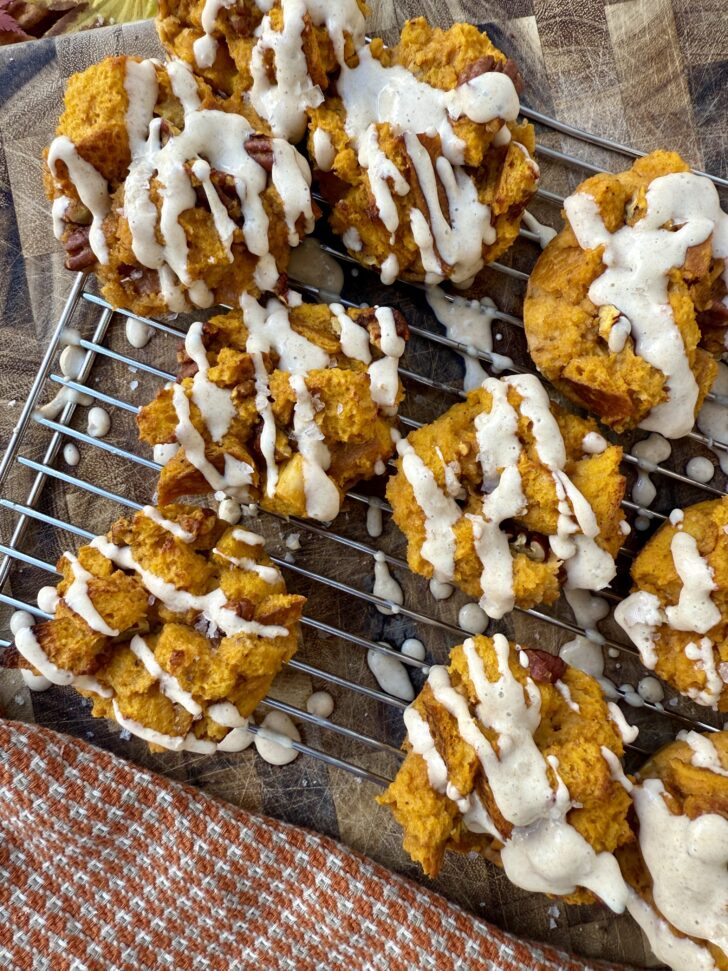 High-protein pumpkin French toast cups topped with creamy date yogurt drizzle, cozy on a fall morning table.
