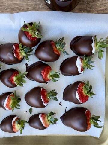 Chocolate-covered strawberries filled with high-protein cottage cheese cheesecake and dipped in dark chocolate
