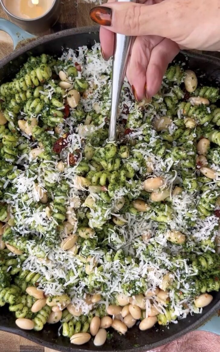 Creamy kale pesto pasta made with rotini pasta, white beans, sun-dried tomatoes, parmesan cheese, and fresh kale pesto topped with extra parmesan. Quick and nourishing vegetarian pasta recipe perfect for healthy weeknight dinners, meal prep, and cozy comfort food meals.