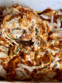 High-protein eggplant lasagna baked with layers of sliced eggplant, creamy ricotta and tofu filling, marinara sauce, melted mozzarella cheese, zucchini, mushrooms, and carrots. Cozy vegetarian comfort food recipe perfect for healthy weeknight dinners and meal prep.